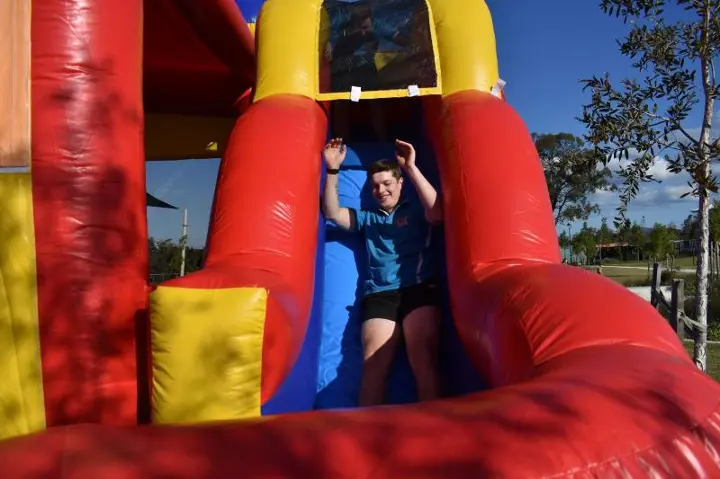 Adults enjoying our inflatable slide